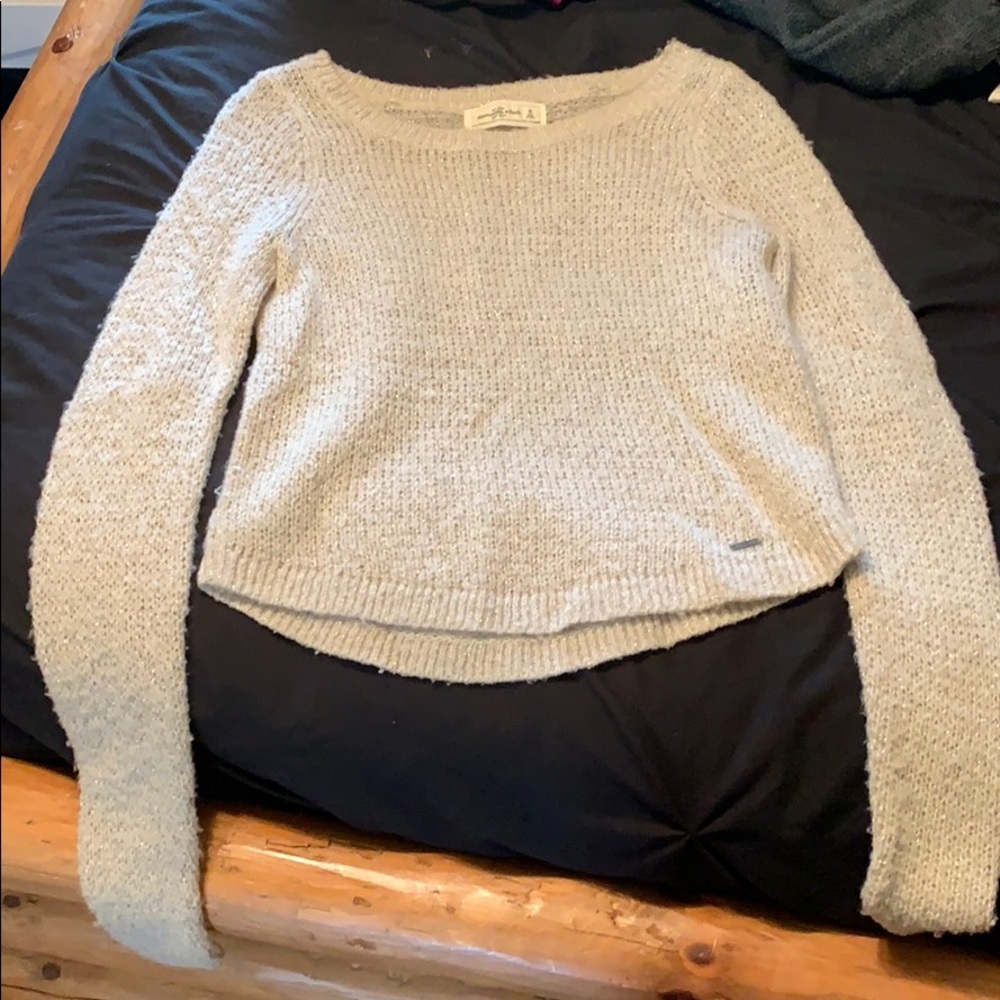 cream and gold sweater